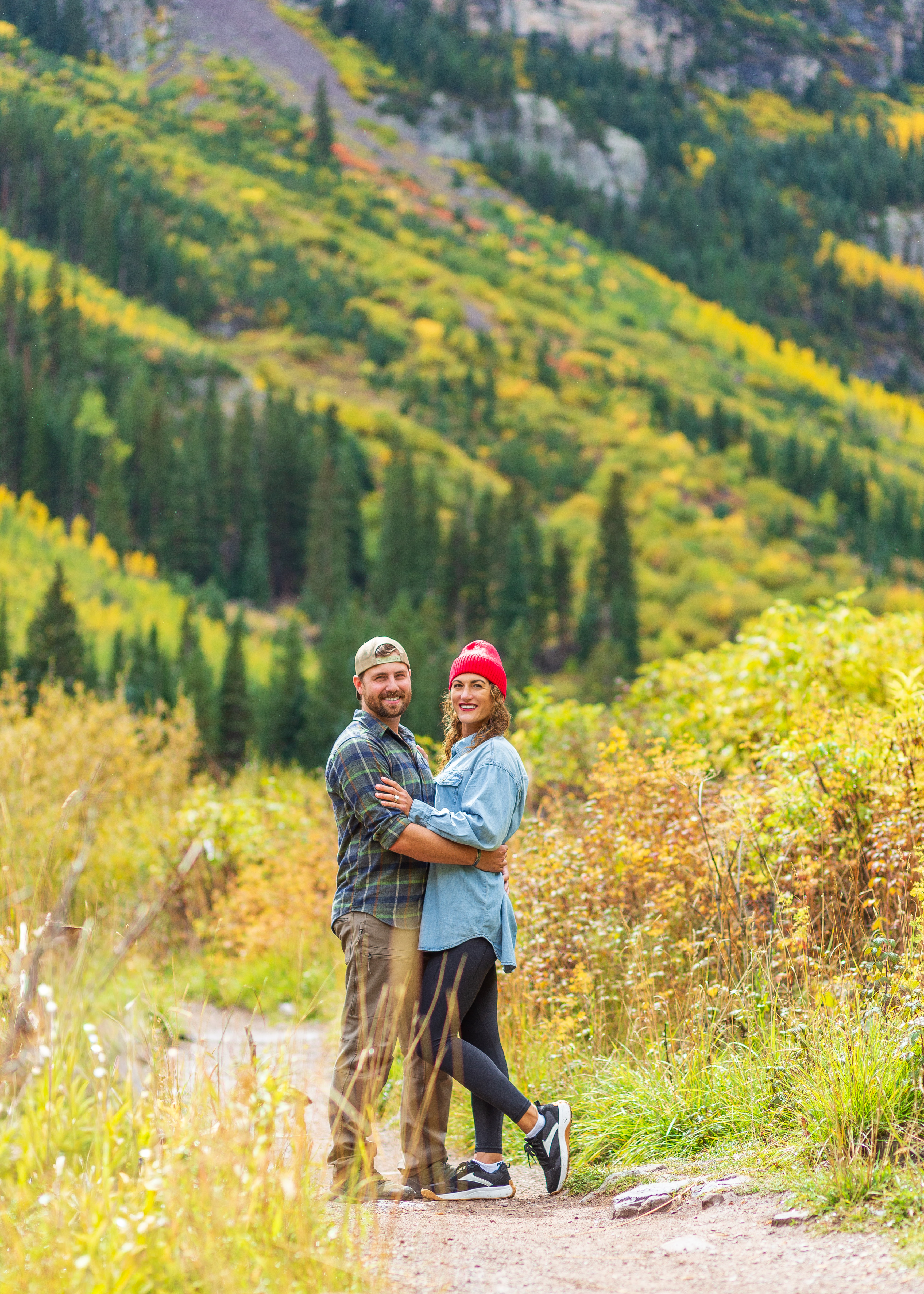 Couple on a mountain overlook at sunset